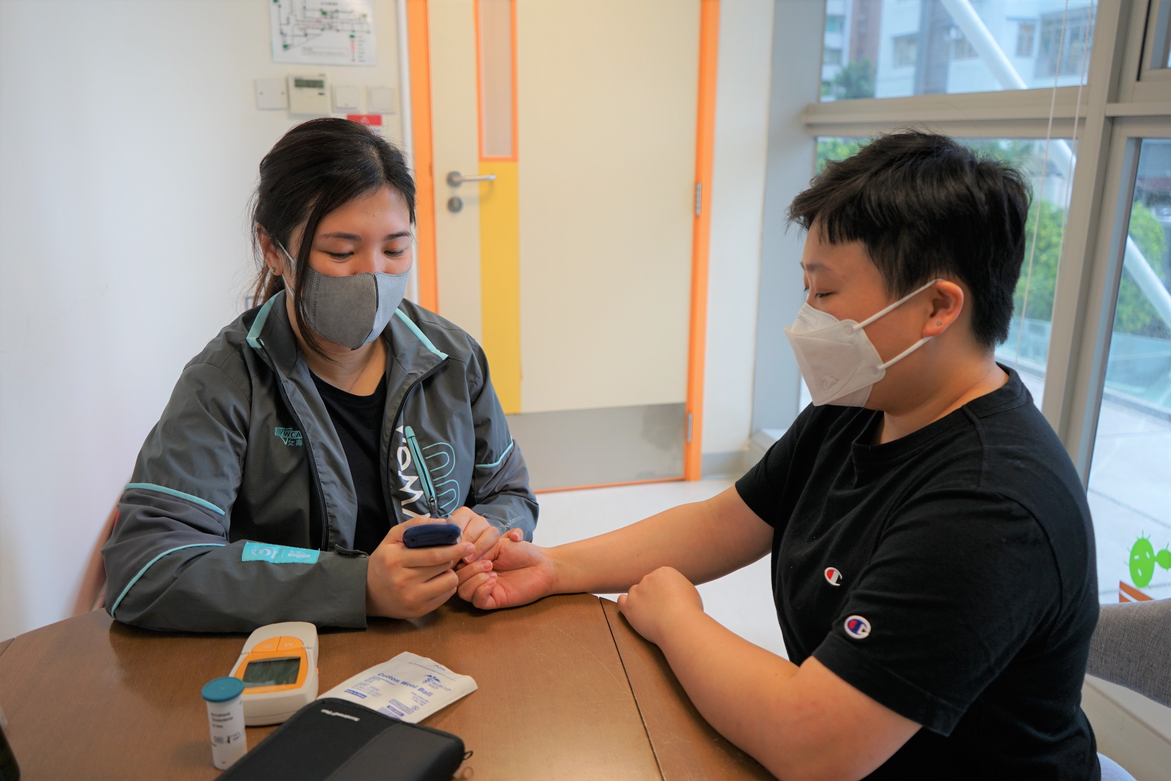 a nurse conducting blood pressure test for a patience