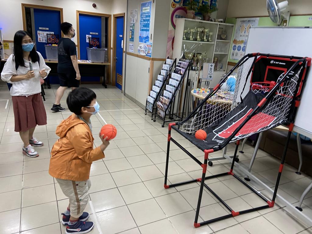 The basketball shooting challenge was popular among the kids.
