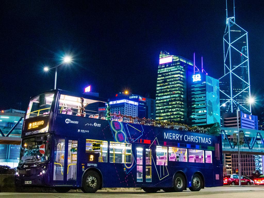 Christmas lights sightseeing and caroling on an open-top bus