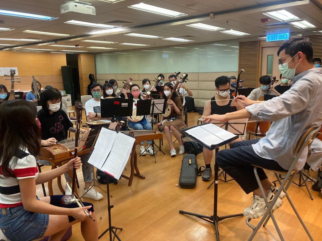 Orchestra members rehearse for the 60th Anniversary Concert.