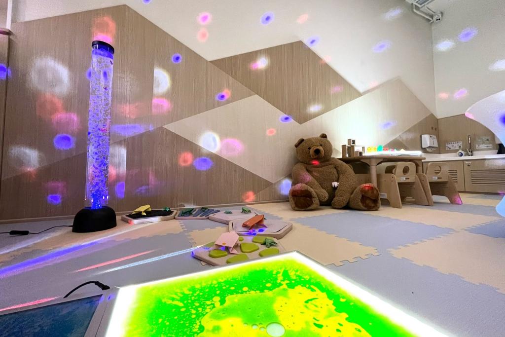 A room with a lot of toys and different lighting effects