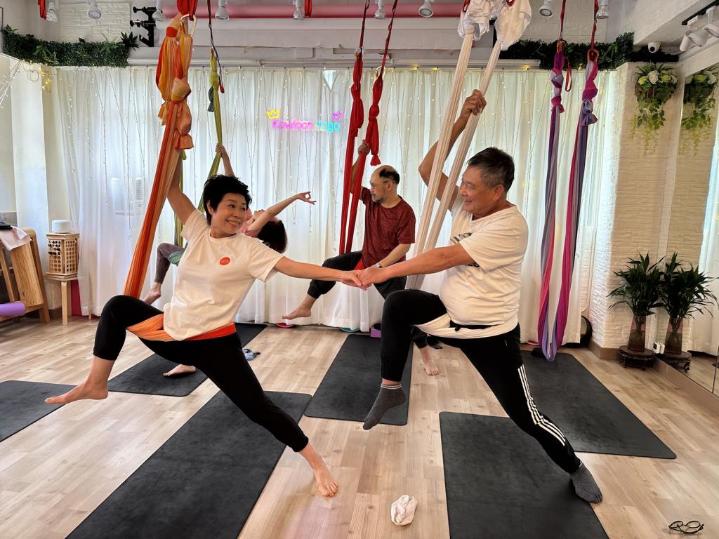 retired couples taking part in arial hammock