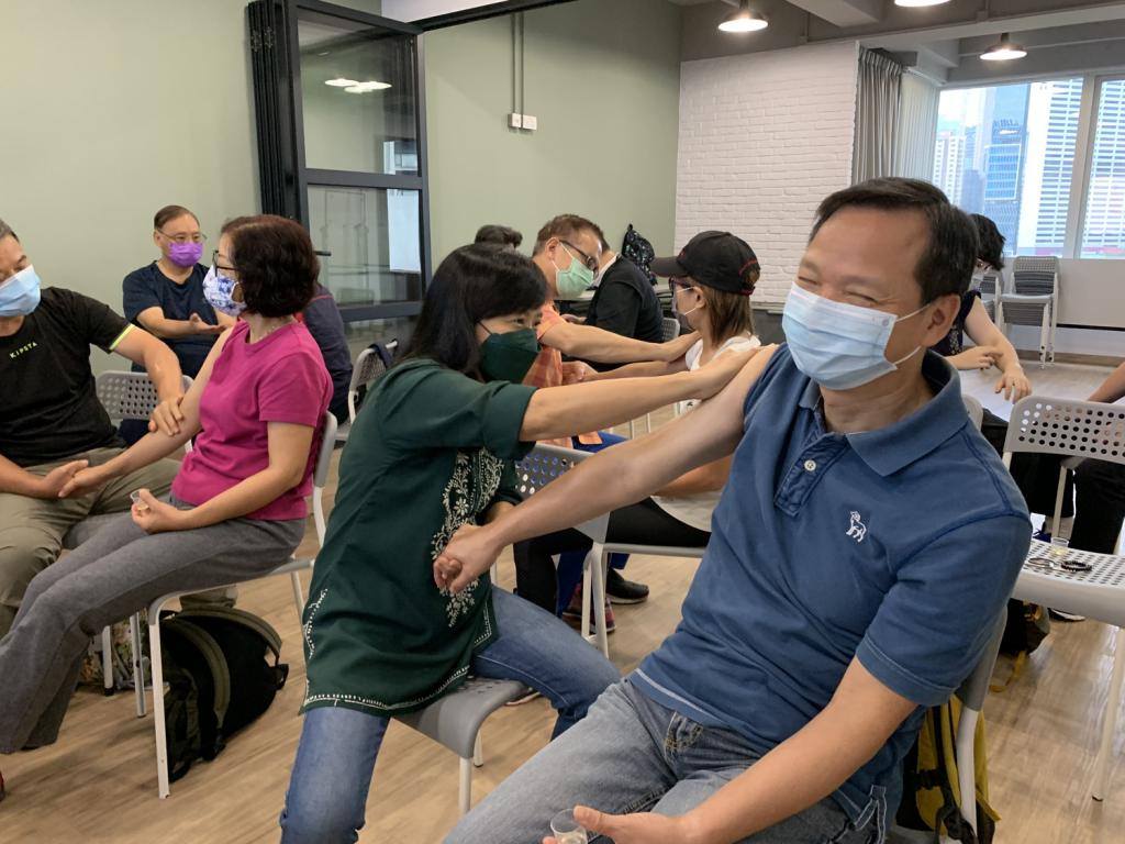 woman helping her husband with aromatherapy massage