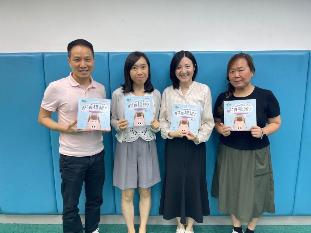 Group photo of 4 including one gentlemen and three ladies.