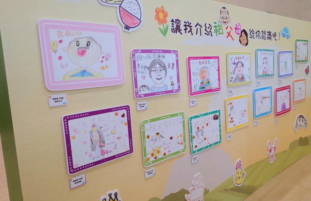 Picture books showcased on the wall.