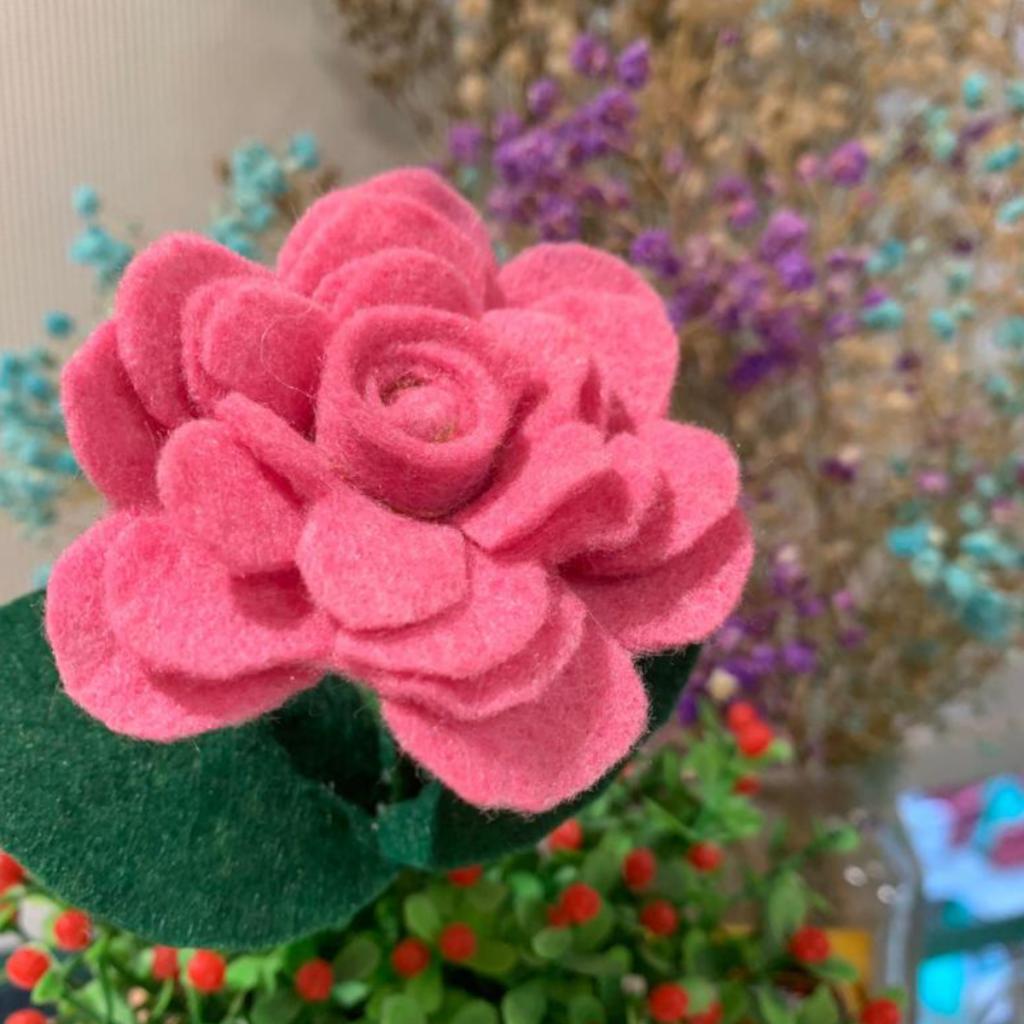 A handmade non-woven fabric flower. 