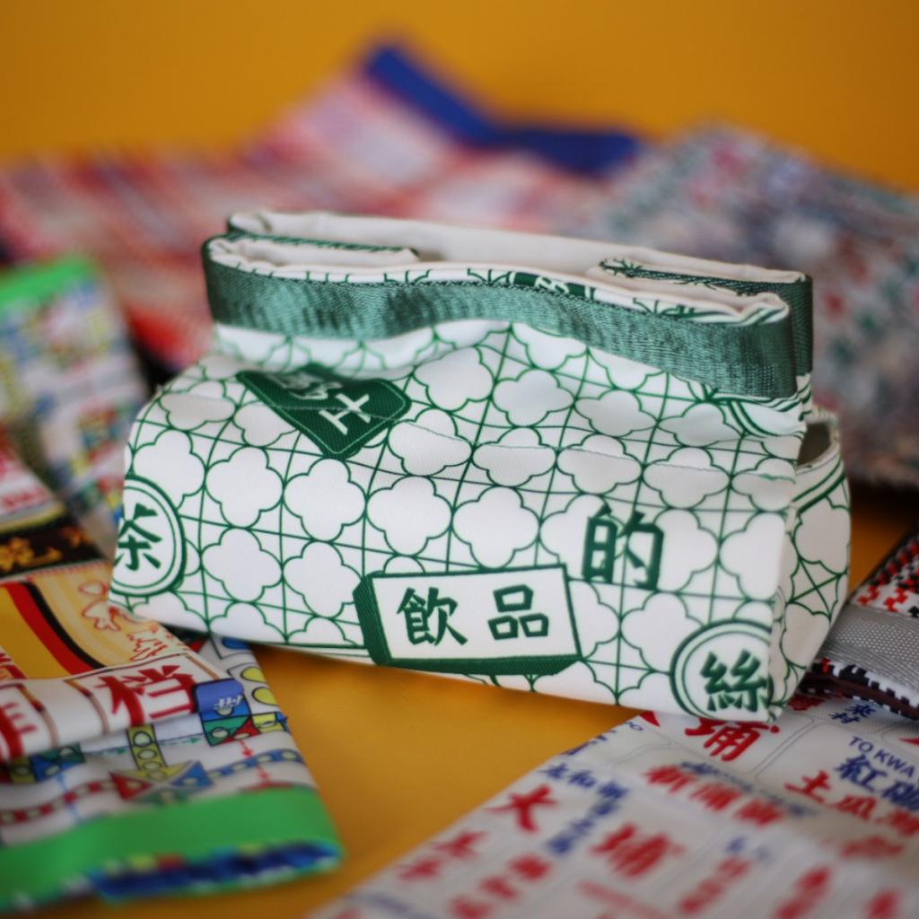 A handmade tissue box made of fabric with Chinese traditional restaurant features. 