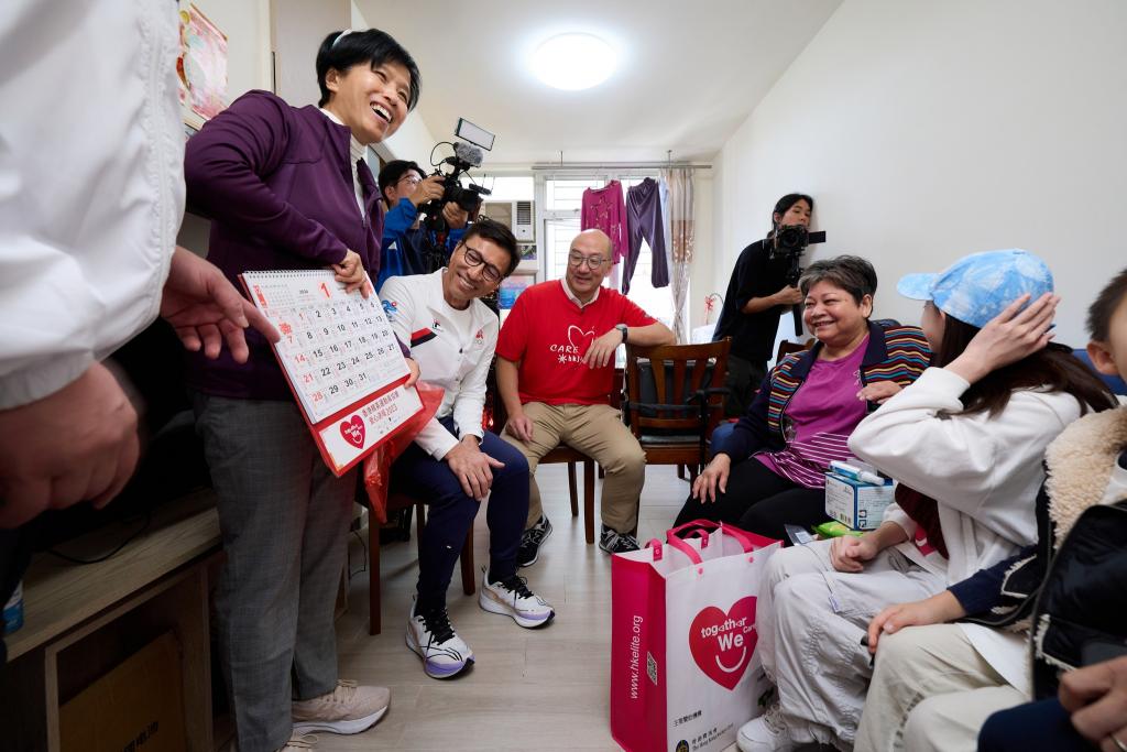 A group of volunteers took photo while they were paying home visit