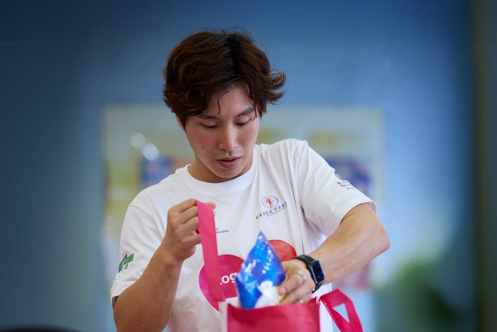 Shek Wai Hung was eager to help prepare gift packs for the families in need.