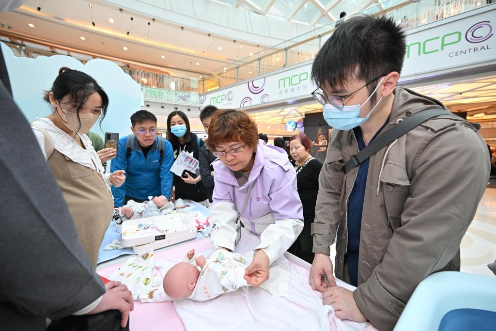 Expectant parents were attentive and focused on the baby caring tips provided by professional.