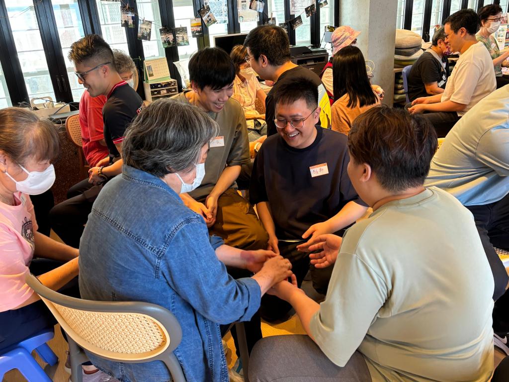 Volunteers and elderly enjoyed playing games together.