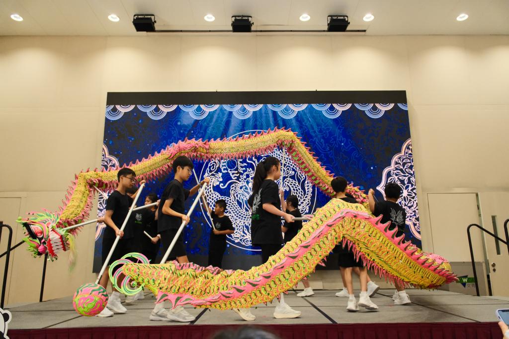 The student dragon dance team kicked off the event, showcasing the youthful energy of the new generation.