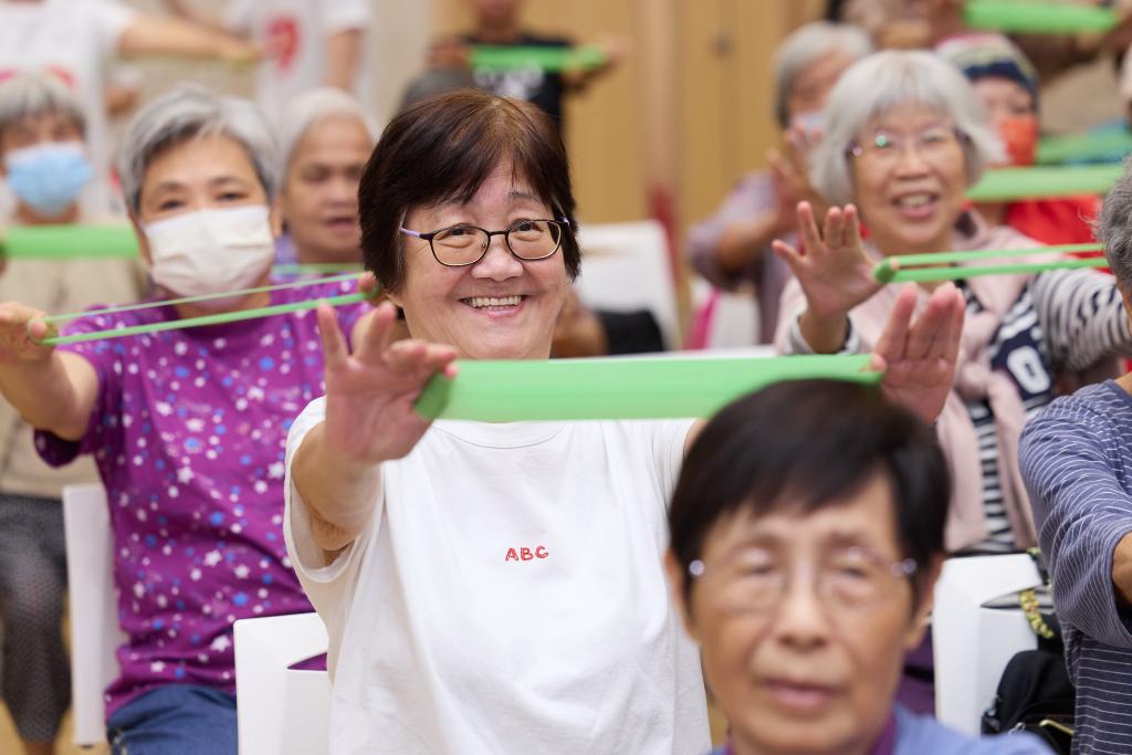 The seniors joined the stretching exercises, radiating energy and creating a vibrant atmosphere.