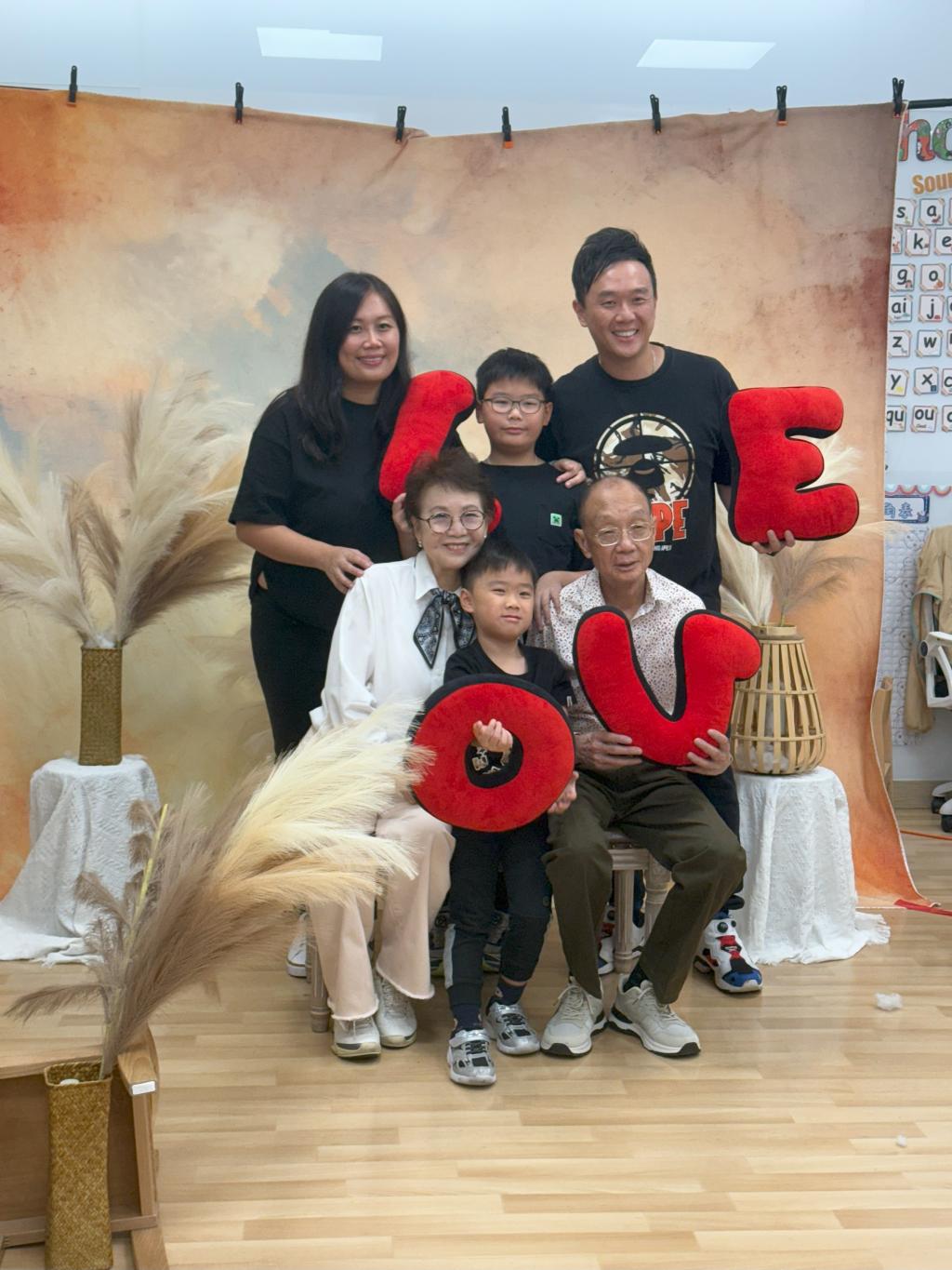 The family portrait of three generations together was touching and rich in ritual significance.